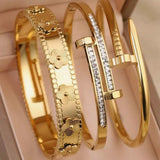 Pulseira Unha de Aço Inoxidável Banhada a Ouro 18K – Kit com 1 ou 3 Peças